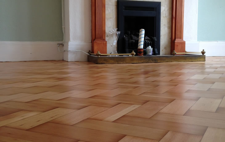 A herringbone parquet floor after restoration